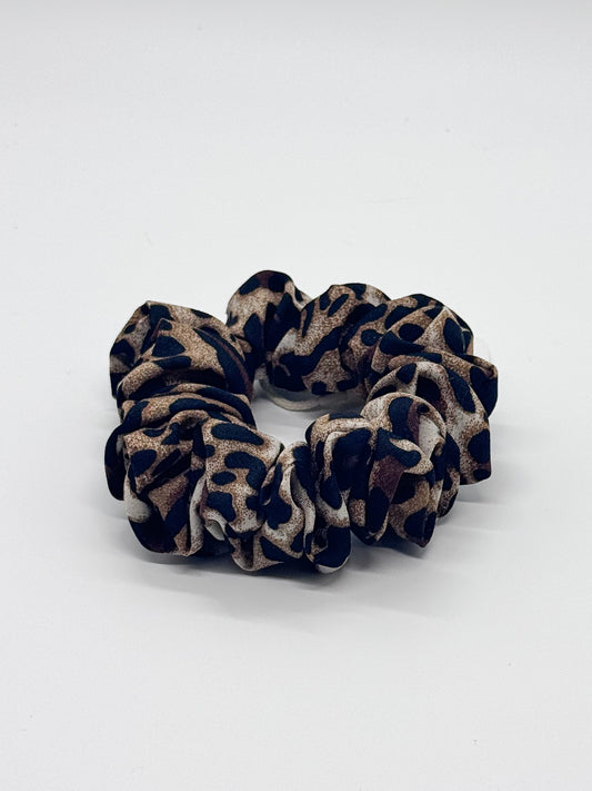 Leopard print scrunchie on a white background