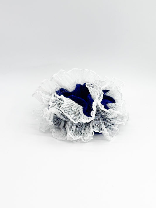 White lace scrunchie with blue center on a white background
