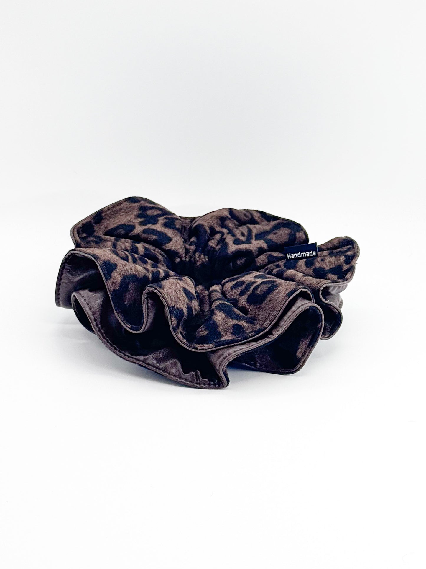 Leopard print scrunchie on a white background