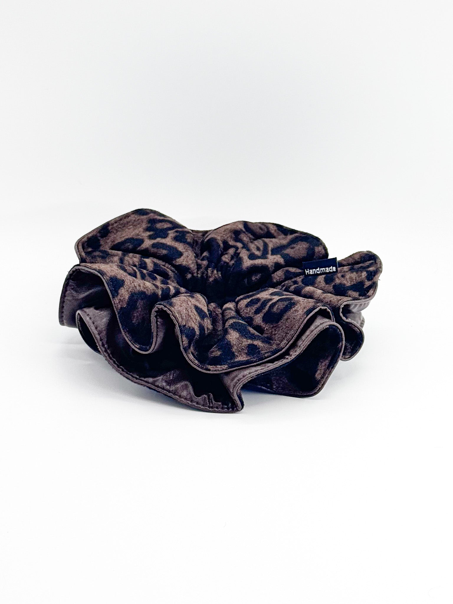 Leopard print scrunchie on a white background