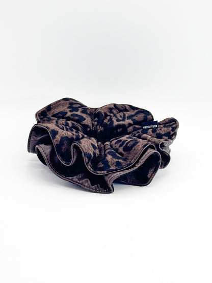Leopard print scrunchie on a white background
