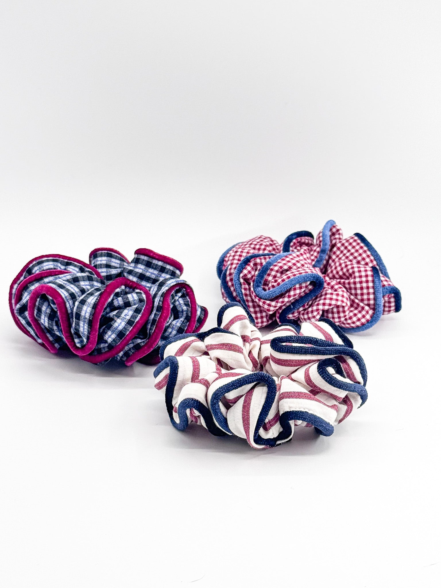 Three patterned scrunchies on a white background
