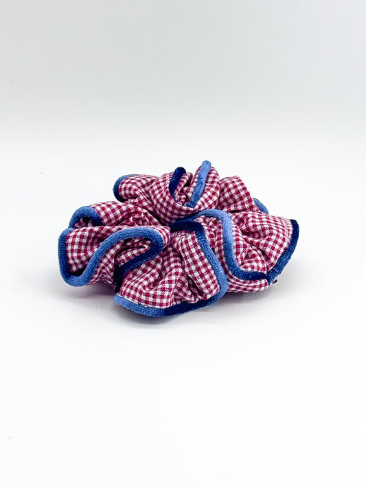 Red and blue checkered scrunchie on a white background