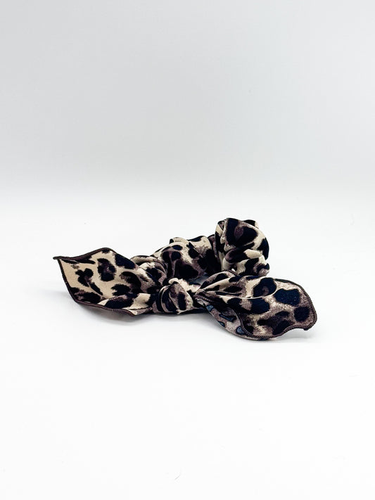 Leopard print hair scrunchie on a white background