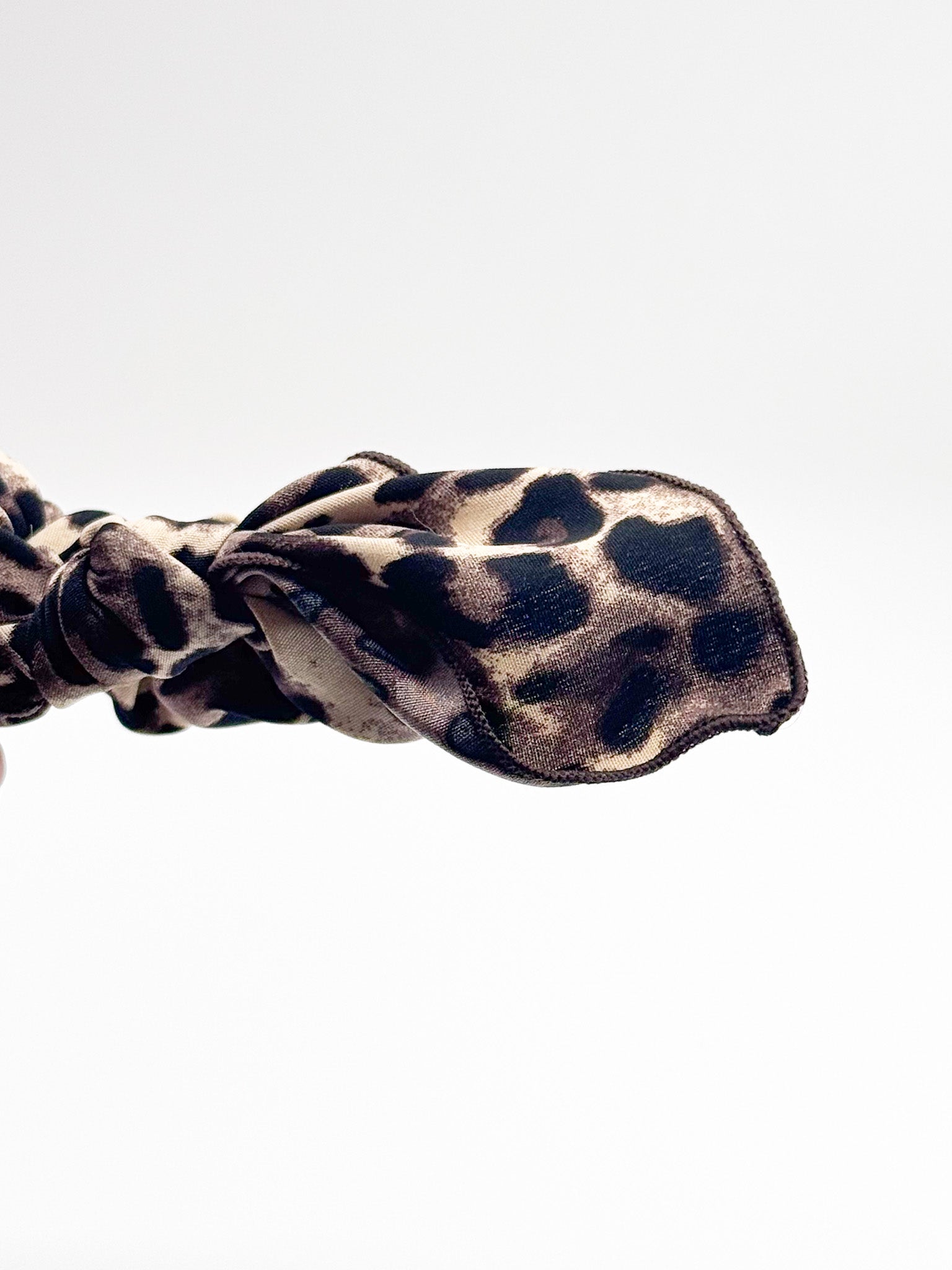 Leopard print scrunchie on a white background