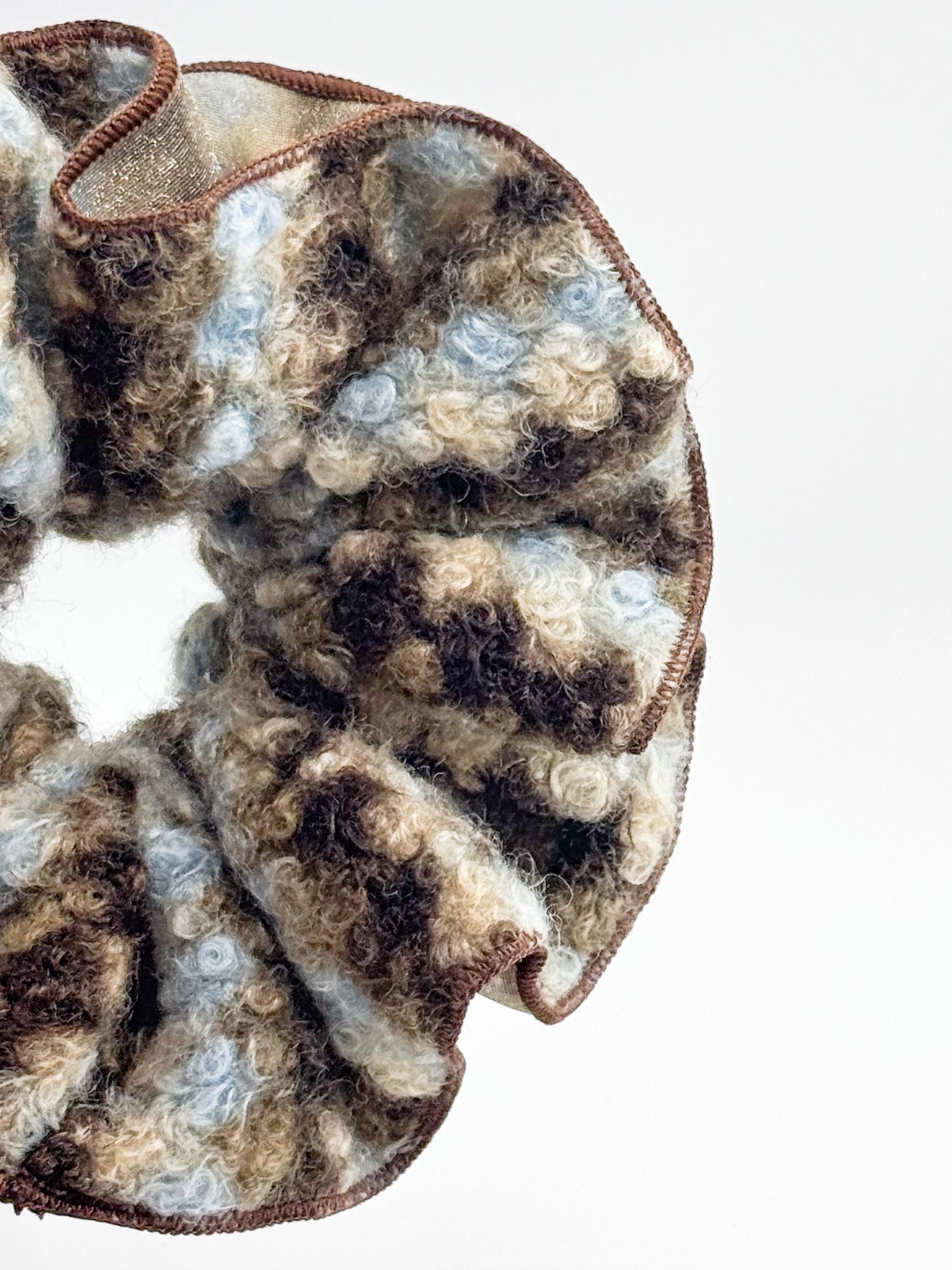 Camouflage-patterned fabric on a white background